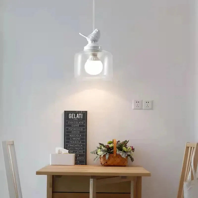 Avelora | Lampa wisząca z ptakiem i szklanym cylindrem